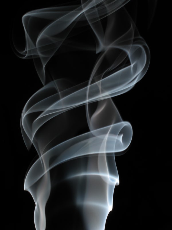 smoke rising on a black background
